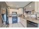 A modern kitchen featuring updated appliances, granite countertops, tiled backsplash, and cabinetry at 633 Schooner Rd, Charleston, SC 29412