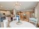 Charming kitchen featuring a decorative chandelier and bright, light-colored accents and an open plan to the dining area at 633 Schooner Rd, Charleston, SC 29412