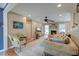 Bright living room with a fireplace, ceiling fan, comfortable seating, and neutral decor for a cozy atmosphere at 633 Schooner Rd, Charleston, SC 29412