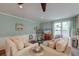 Bright and spacious living room with ceiling fan and entertainment center at 633 Schooner Rd, Charleston, SC 29412
