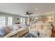 Inviting living area showcasing comfortable seating, large windows, and seamless flow to the bedroom and outdoor spaces at 633 Schooner Rd, Charleston, SC 29412