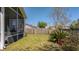 Landscaped backyard featuring a patio and privacy fence at 8208 Little Sydneys Way, North Charleston, SC 29406