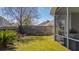 Landscaped backyard featuring a bench, patio, and privacy fence at 8208 Little Sydneys Way, North Charleston, SC 29406