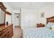 Cozy bedroom featuring blue and white bedding, ceiling fan, and hardwood furniture at 8208 Little Sydneys Way, North Charleston, SC 29406