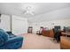 Spacious bonus room with plush carpet, ceiling fan, walk-in closet, and ample space for relaxing and working at 8208 Little Sydneys Way, North Charleston, SC 29406