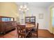 Bright dining room with hardwood floors, stylish lighting and furniture at 8208 Little Sydneys Way, North Charleston, SC 29406
