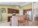 Open kitchen with granite countertops, stainless steel appliances, and breakfast bar seating at 8208 Little Sydneys Way, North Charleston, SC 29406