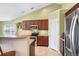 Bright kitchen with granite countertops, stainless steel appliances, and breakfast bar seating at 8208 Little Sydneys Way, North Charleston, SC 29406