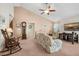 Inviting living room with vaulted ceilings, neutral walls and carpet, and ceiling fan at 8208 Little Sydneys Way, North Charleston, SC 29406