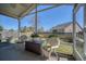 View of the outdoor patio with wicker furniture, pond view and privacy fence at 8208 Little Sydneys Way, North Charleston, SC 29406