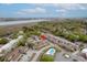 Aerial view of condo community with a swimming pool, lush greenery, and proximity to water at 874 Colony Drive # B19, Charleston, SC 29407