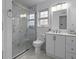 Bathroom featuring a modern vanity, updated fixtures, toilet, and shower with glass door and marble design at 874 Colony Drive # B19, Charleston, SC 29407