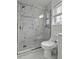 Bathroom featuring a modern vanity, updated fixtures, toilet, and shower with glass door and marble design at 874 Colony Drive # B19, Charleston, SC 29407