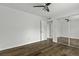This bedroom features hardwood floors, a ceiling fan, and a mirrored closet at 874 Colony Drive # B19, Charleston, SC 29407