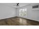 Spacious bedroom with hardwood floors, ample natural light, and a ceiling fan at 874 Colony Drive # B19, Charleston, SC 29407