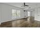Bedroom featuring hardwood floors, a ceiling fan, and a mirrored closet door at 874 Colony Drive # B19, Charleston, SC 29407