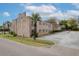 Exterior shot of a two-story condo building in a community with a large parking area at 874 Colony Drive # B19, Charleston, SC 29407