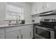 Updated kitchen with granite countertops, stainless steel appliances, and modern fixtures at 874 Colony Drive # B19, Charleston, SC 29407
