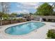 Community pool surrounded by lounge chairs and landscaping at 874 Colony Drive # B19, Charleston, SC 29407