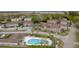 Aerial shot of condo community swimming pool featuring lounge chairs and palm trees at 874 Colony Drive # B19, Charleston, SC 29407