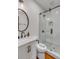 Bathroom with black fixtures, a white vanity, patterned walls and a glass enclosed shower at 90 Spring St # Ab, Charleston, SC 29403
