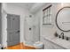 Bathroom featuring a glass shower, toilet, and marble sink at 90 Spring St # Ab, Charleston, SC 29403