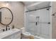 Bathroom boasts stylish wallpaper, marble countertop, and a glass enclosed shower with white subway tile at 90 Spring St # Ab, Charleston, SC 29403