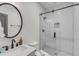 Modern bathroom featuring white subway tile shower, a dark mirror, and stylish fixtures at 90 Spring St # Ab, Charleston, SC 29403