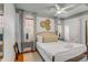 Charming bedroom featuring soft lighting, neutral décor, and views of outdoors at 90 Spring St # Ab, Charleston, SC 29403