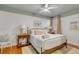 Bedroom with hardwood floors, ceiling fan, side tables, and natural light from the window at 90 Spring St # Ab, Charleston, SC 29403