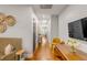 Bright hallway showcasing hardwood floors, decorative baskets, and stylish furniture at 90 Spring St # Ab, Charleston, SC 29403