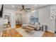 Comfortable living room with a sofa, artwork, and dining area at 90 Spring St # Ab, Charleston, SC 29403