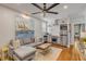 Stylish living room featuring a modern sofa, artwork, and hardwood floors at 90 Spring St # Ab, Charleston, SC 29403