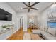 Bright living room with hardwood floors, sofa, and view into dining area at 90 Spring St # Ab, Charleston, SC 29403