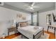 Comfortable main bedroom featuring a bed, ceiling fan, and bedside lamps at 90 Spring St # Ab, Charleston, SC 29403