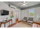 A comfortable sitting room featuring a leather couch, chairs, and artwork at 90 Spring St # Ab, Charleston, SC 29403