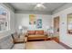A comfortable sitting room featuring a leather couch, chairs, and artwork at 90 Spring St # Ab, Charleston, SC 29403