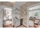 Stylish wet bar with a sink, shelving, wallpaper, and a beverage fridge at 90 Spring St # Ab, Charleston, SC 29403