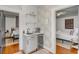 Wet bar with quartz countertop, under counter fridge, and a view of two separate bedrooms at 90 Spring St # Ab, Charleston, SC 29403