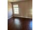 Bedroom with hardwood floors and neutral paint tones for a calming atmosphere at 9028 Maple Grove Dr, Summerville, SC 29485