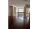 Hallway with hardwood floors and access to a bedroom through a white doorway at 9028 Maple Grove Dr, Summerville, SC 29485
