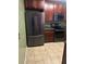 Functional kitchen with dark wood cabinetry, granite counters, and stainless steel appliances at 9028 Maple Grove Dr, Summerville, SC 29485