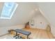 Finished attic space featuring a skylight, bench, and laminate flooring at 928 Ashley Ave, Charleston, SC 29403