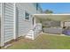 Exterior view showcasing a covered porch with comfortable seating and a decorative screen at 928 Ashley Ave, Charleston, SC 29403