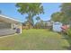 A large green backyard featuring an outdoor seating area and storage shed at 928 Ashley Ave, Charleston, SC 29403