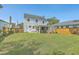 Large backyard showcasing a lush lawn and an inviting covered patio area for outdoor enjoyment at 928 Ashley Ave, Charleston, SC 29403