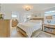 Bright bedroom featuring a plush king-sized bed, hardwood floors and plenty of natural light at 928 Ashley Ave, Charleston, SC 29403
