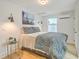 Cozy bedroom with a queen bed, mini-split, and hardwood floors at 928 Ashley Ave, Charleston, SC 29403