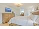 Bright bedroom featuring a plush king-sized bed, hardwood floors and plenty of natural light at 928 Ashley Ave, Charleston, SC 29403