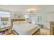 Bright bedroom featuring a plush king-sized bed, hardwood floors and plenty of natural light at 928 Ashley Ave, Charleston, SC 29403